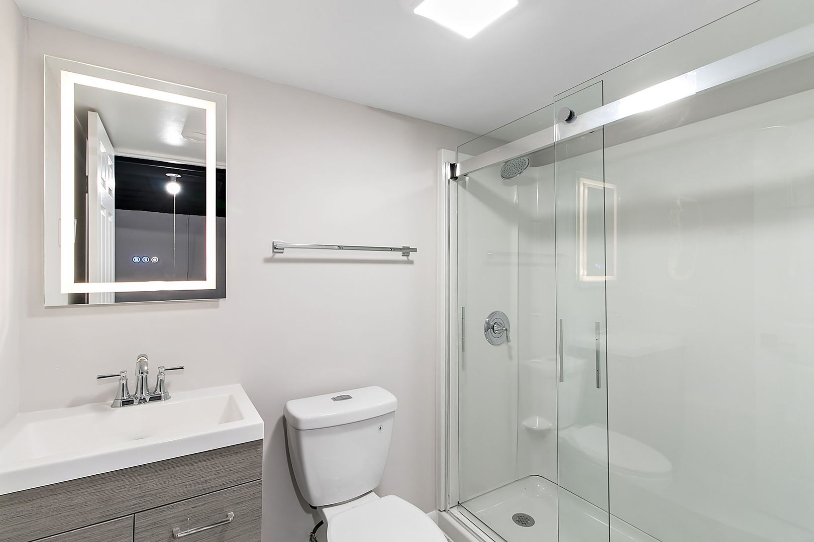 23519 West Renwick Road Plainfield, IL 60586 - Photo 9 of 22 a bathroom with a shower sink mirror and toilet