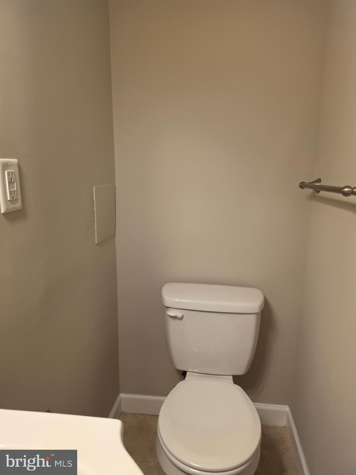 2028 Hillenwood Road Baltimore, MD 21239 - Photo 18 of 18 a white toilet sitting next to a white wall