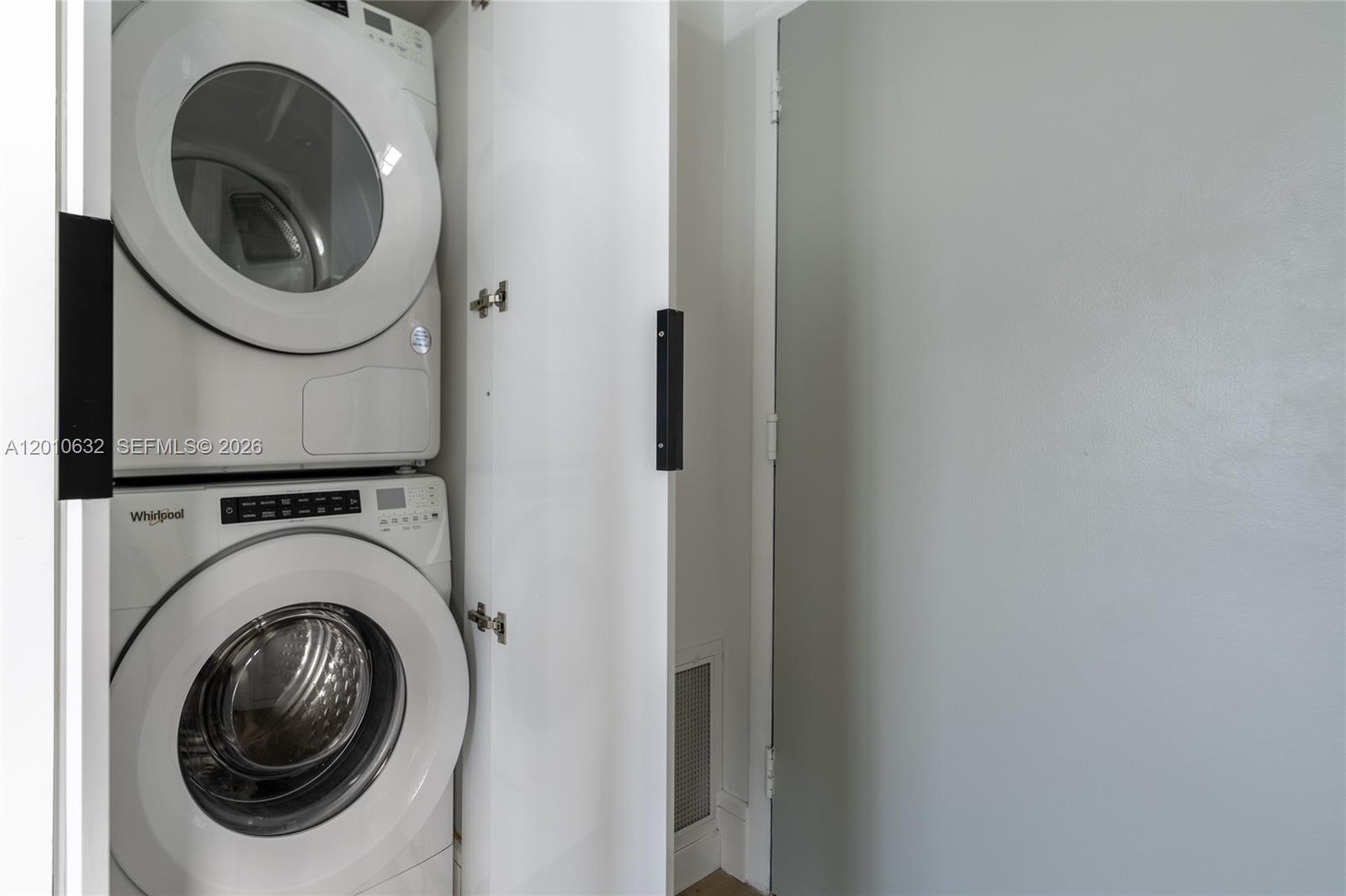 2639 North Riverside Drive, Unit 501 Pompano Beach, FL 33062 - Photo 15 of 39 a close up view of a washer and dryer