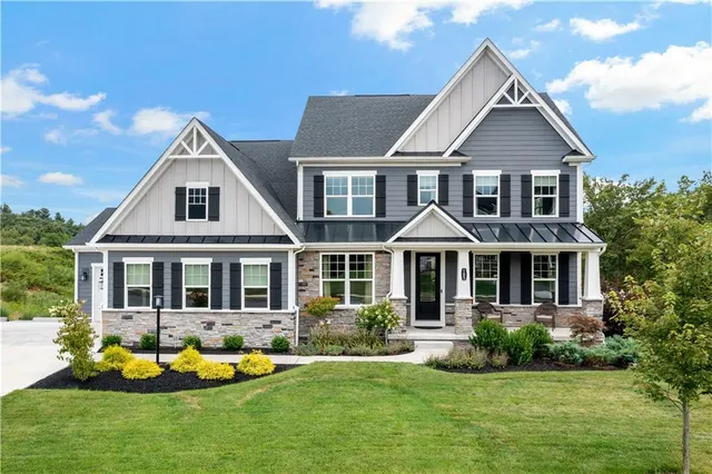 front view of a house with a yard