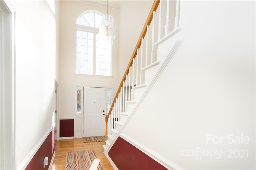 7424 Reedy Creek Road Charlotte, NC 28215 - Photo 4 of 48 a view of entryway and hall with wooden floor