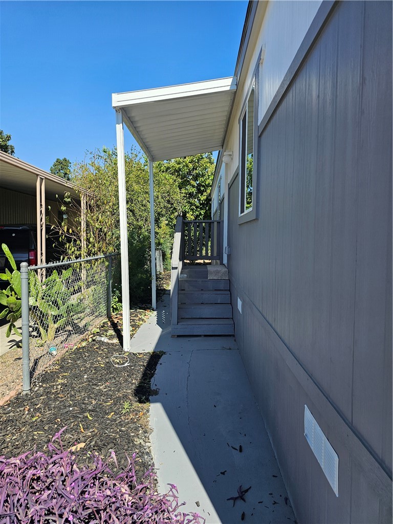 1560 Massachussetts Avenue, Unit 94 Riverside, CA 92570 - Photo 3 of 15 a view of a house with backyard and porch