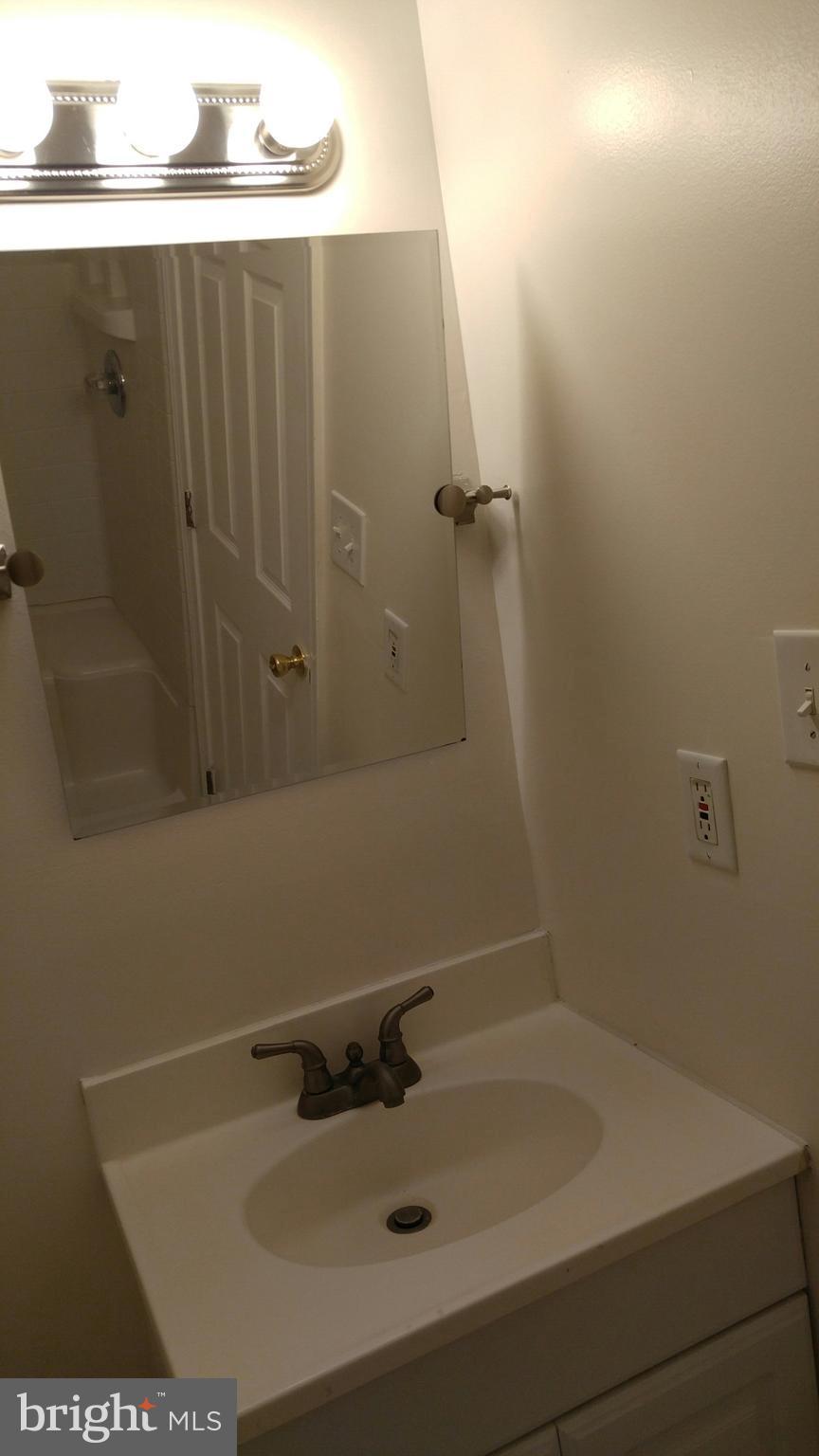 102 Chatham Square Winchester, VA 22601 - Photo 14 of 29 a bathroom with a sink and vanity