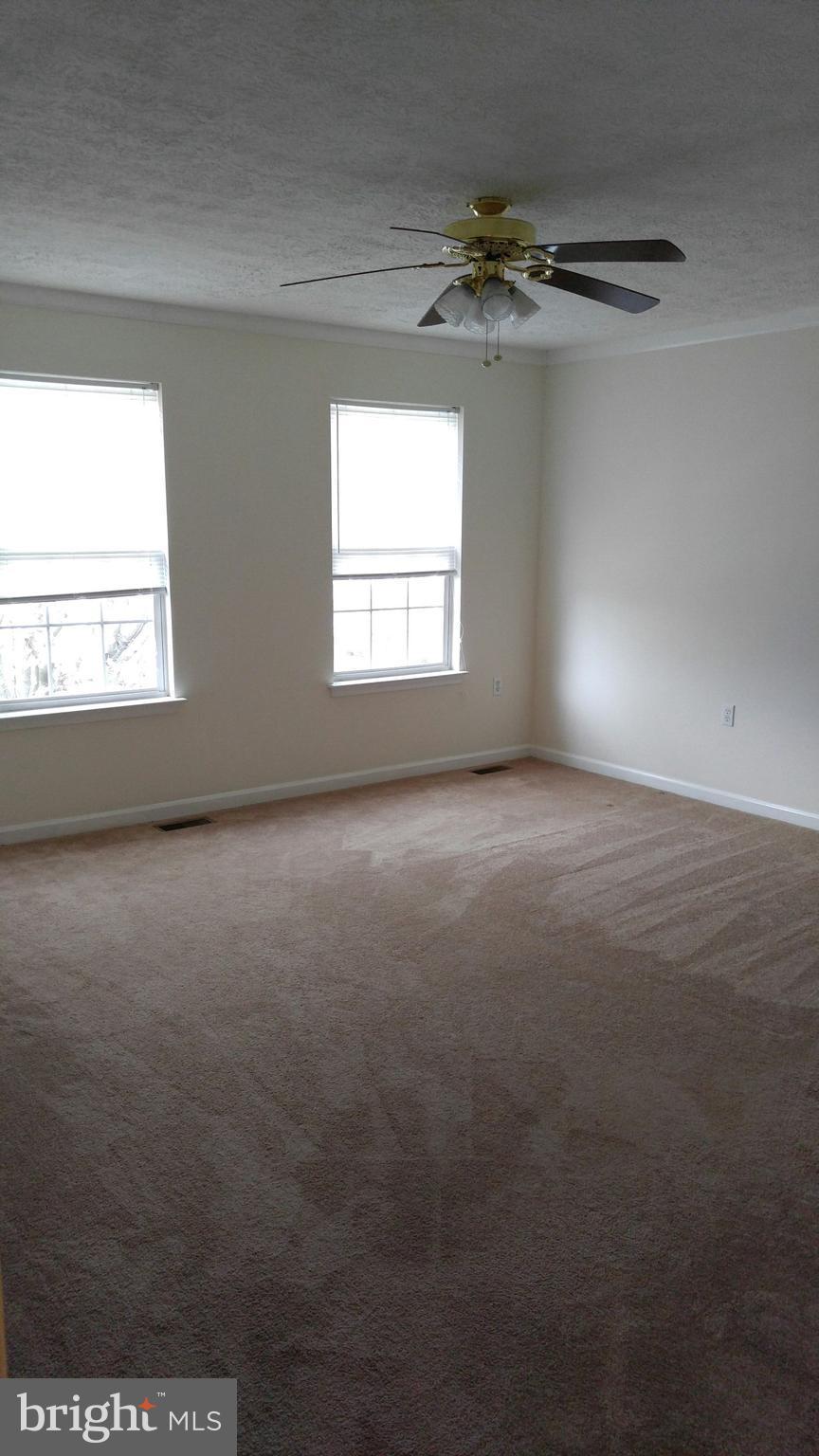 102 Chatham Square Winchester, VA 22601 - Photo 17 of 29 a view of a room with a ceiling fan and window