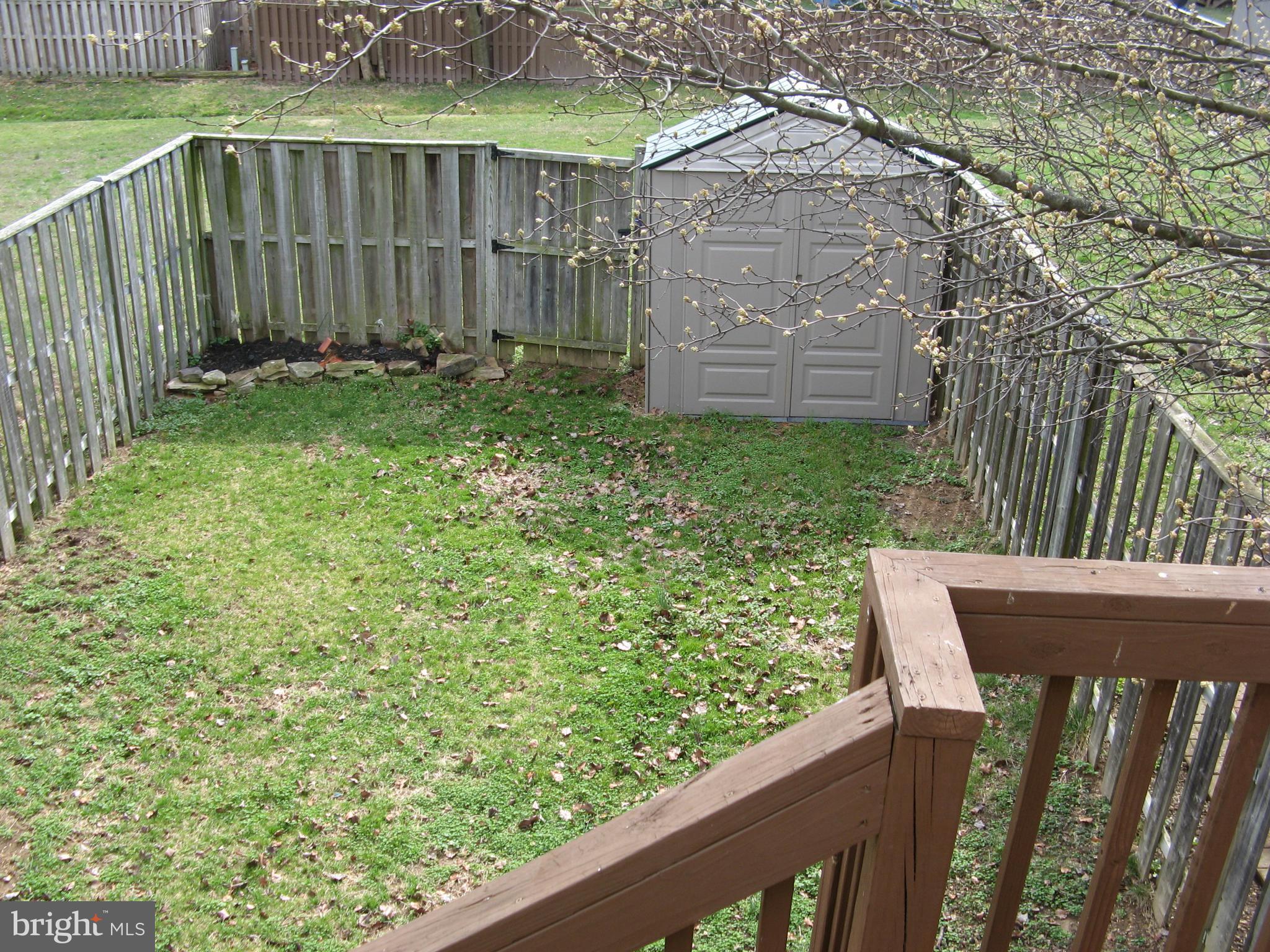 102 Chatham Square Winchester, VA 22601 - Photo 24 of 29 a view of a wooden fence and a bench