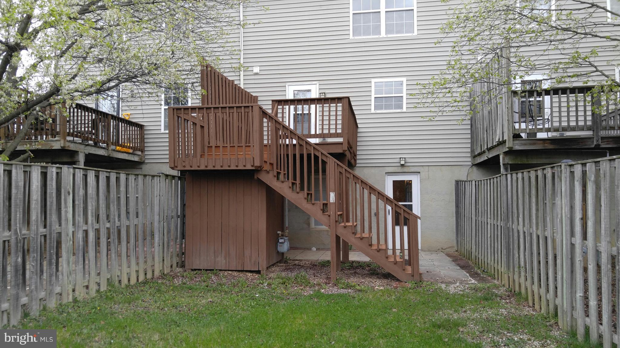 102 Chatham Square Winchester, VA 22601 - Photo 26 of 29 a view of backyard with deck and wooden fence