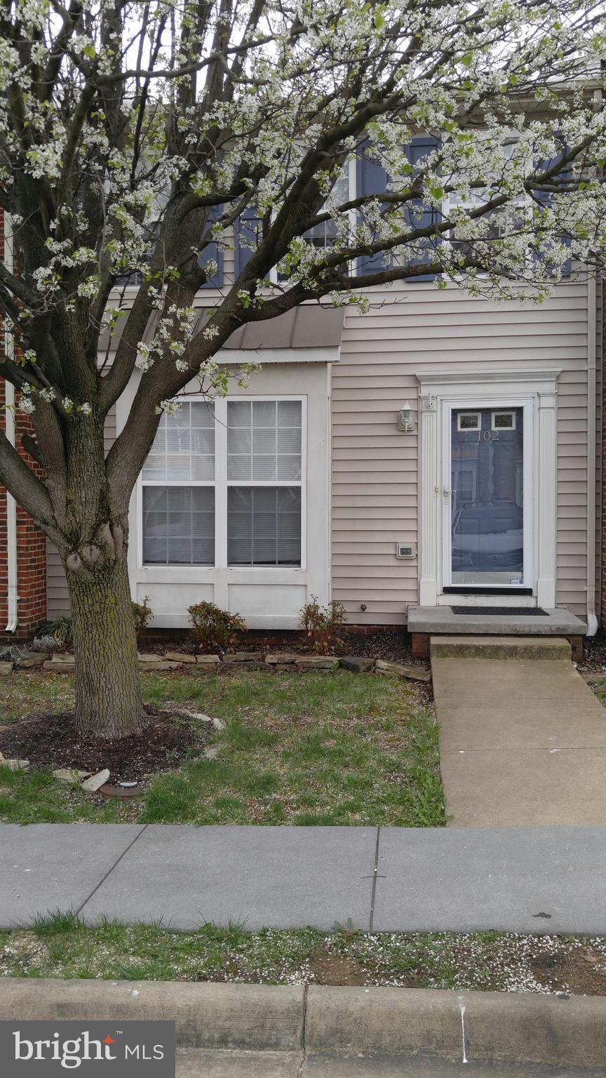 102 Chatham Square Winchester, VA 22601 - Photo 28 of 29 a front view of a house with a yard