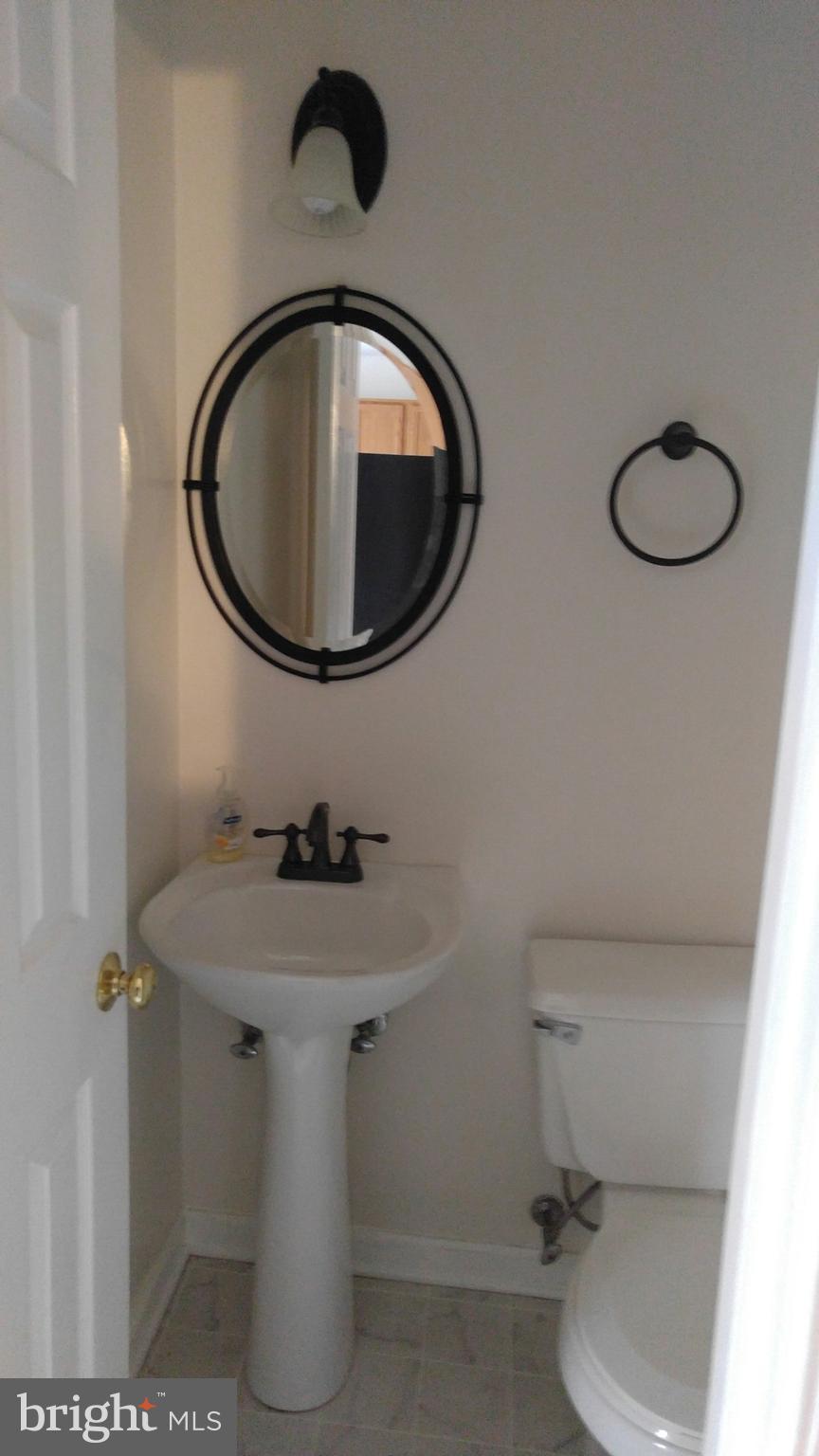 102 Chatham Square Winchester, VA 22601 - Photo 8 of 29 a bathroom with a sink toilet and mirror