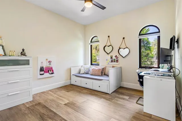 a living room with lots of furniture and a large window