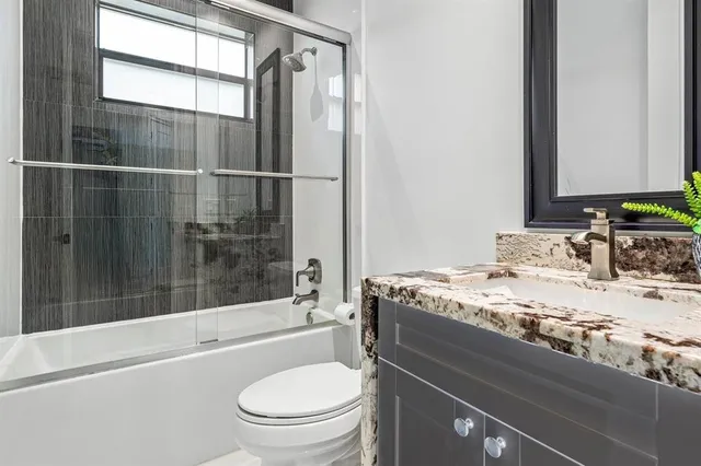 a view of living room with furniture and floor to ceiling window