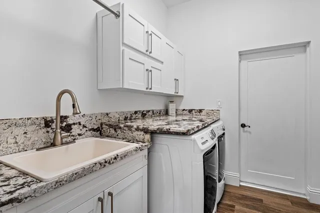 a view of a house with swimming pool and sitting area