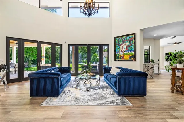 a kitchen with stainless steel appliances kitchen island granite countertop a stove a sink and a refrigerator