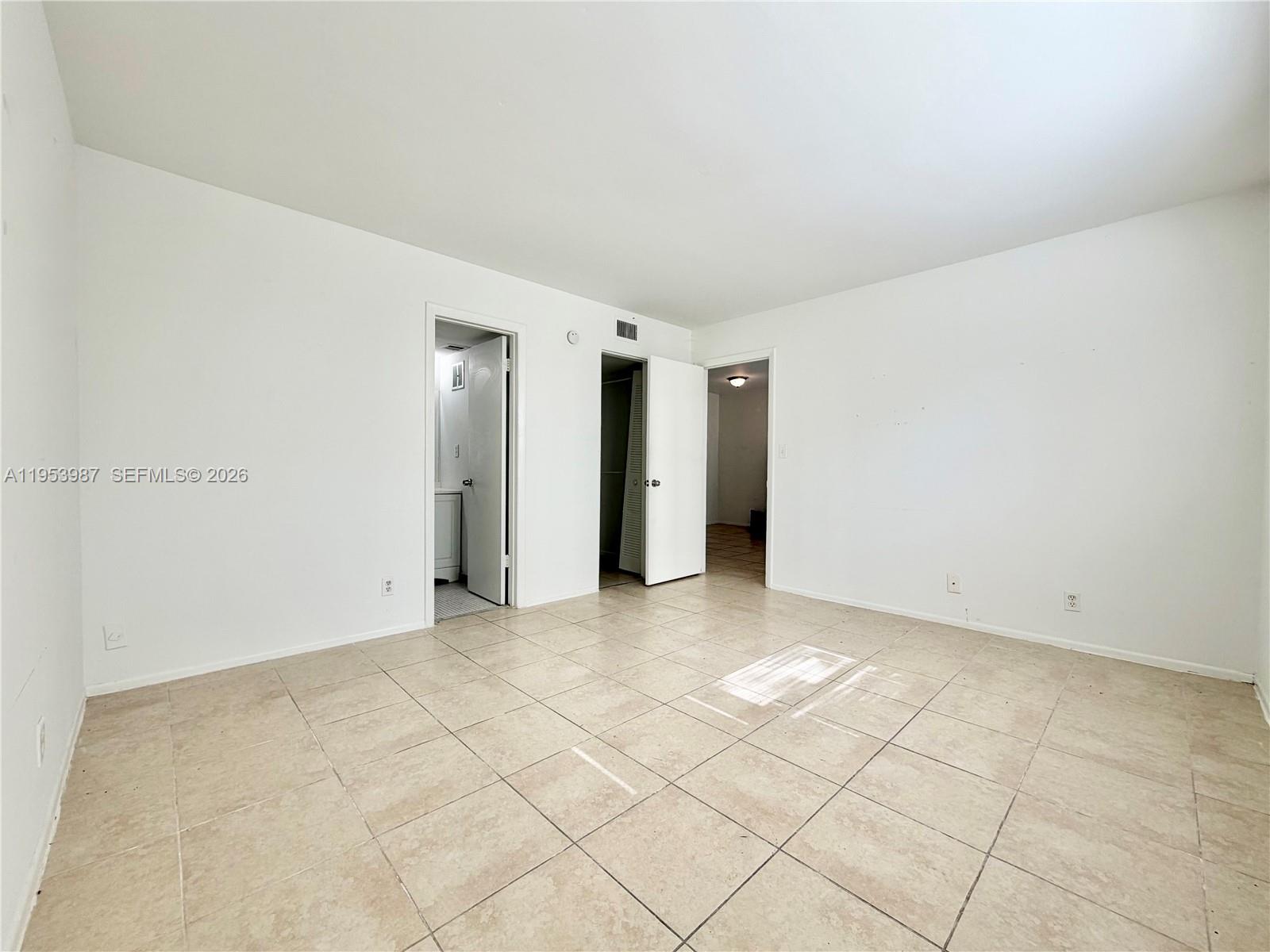8000 Fairview Drive, Unit 203 Tamarac, FL 33321 - Photo 12 of 29 an empty room with a natural light
