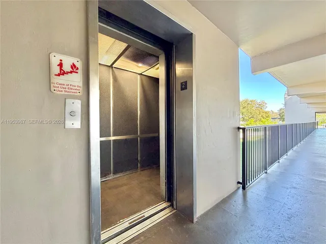 a view of a hallway with workspace