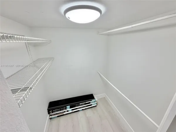 a view of a room with racks on the wall