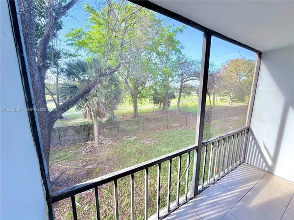 a view of balcony with wooden floor