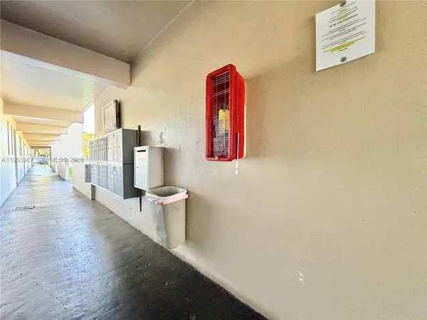 a view of a swimming pool with a patio and a yard