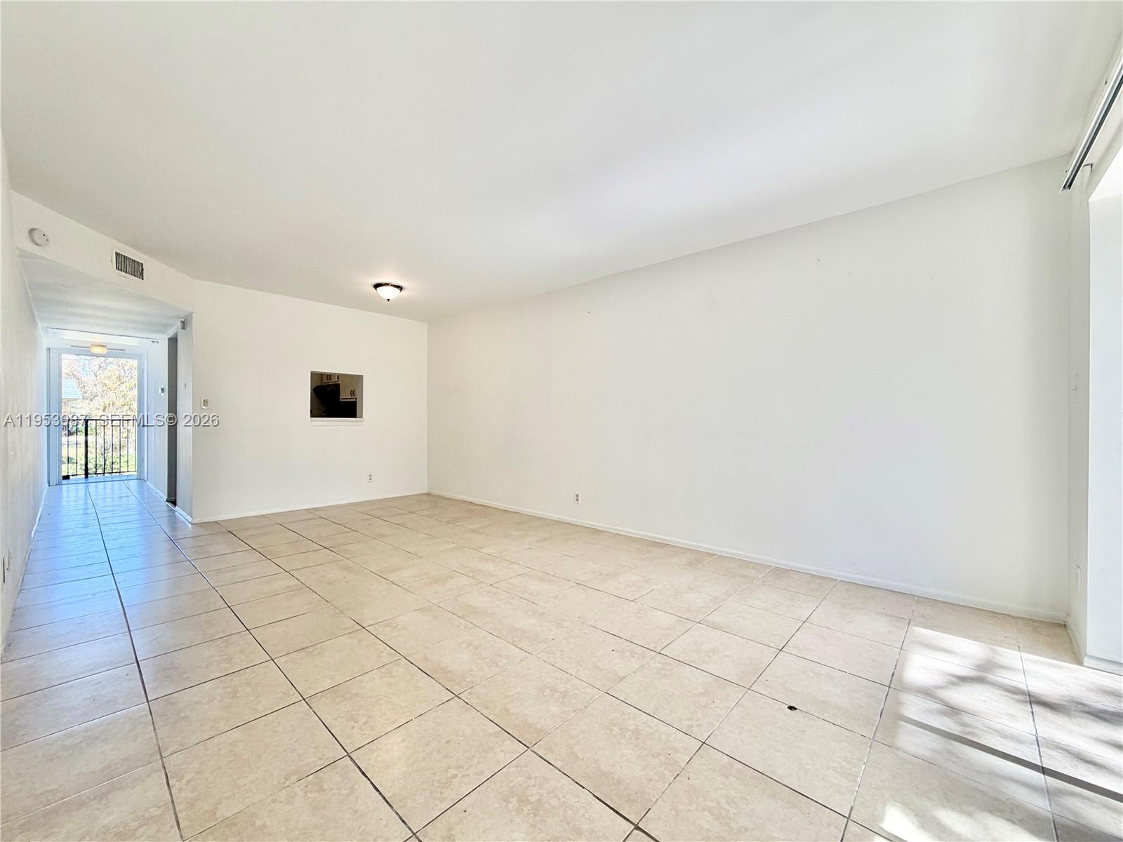 8000 Fairview Drive, Unit 203 Tamarac, FL 33321 - Photo 6 of 29 a view of an empty room and window