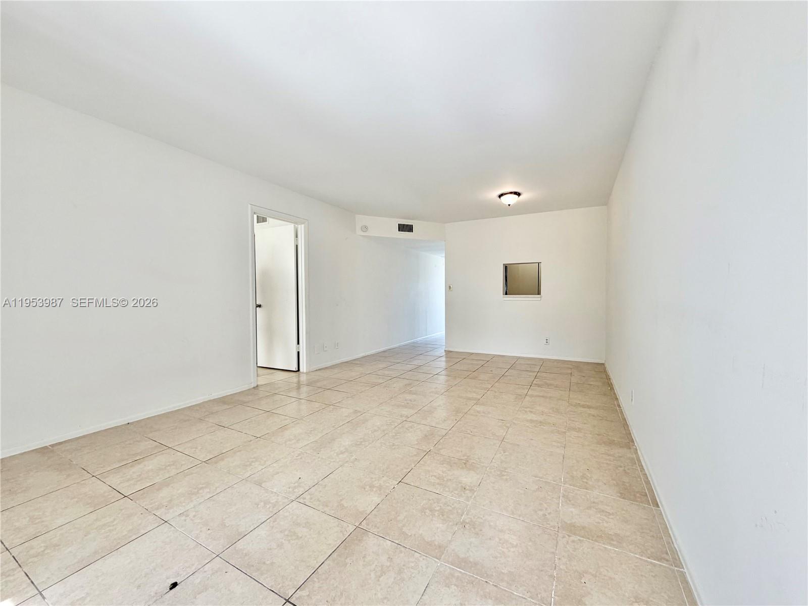 8000 Fairview Drive, Unit 203 Tamarac, FL 33321 - Photo 7 of 29 an empty room with white walls