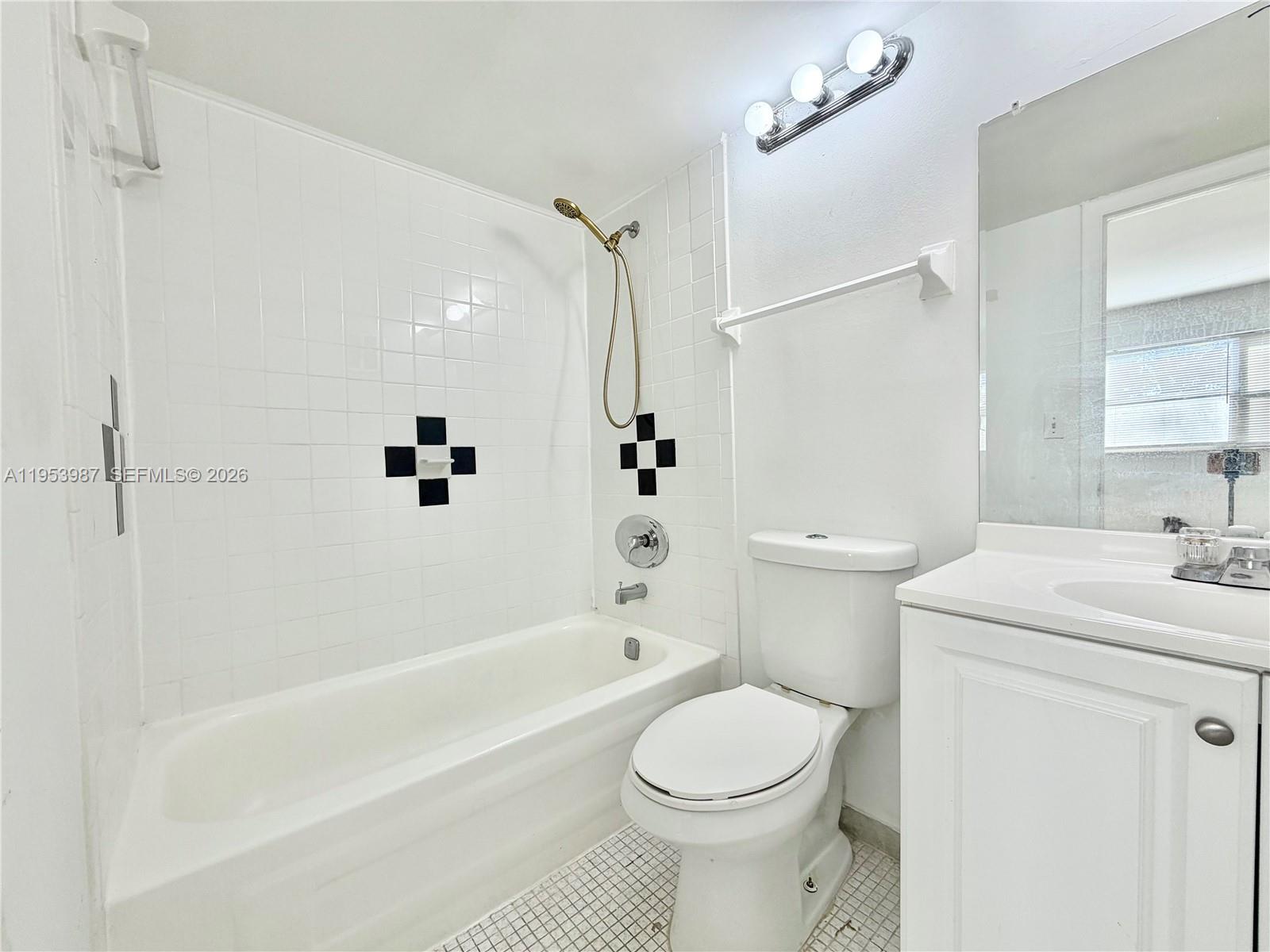 8000 Fairview Drive, Unit 203 Tamarac, FL 33321 - Photo 10 of 29 a bathroom with a sink toilet and shower