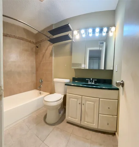 a bathroom with a toilet a sink and bathtub