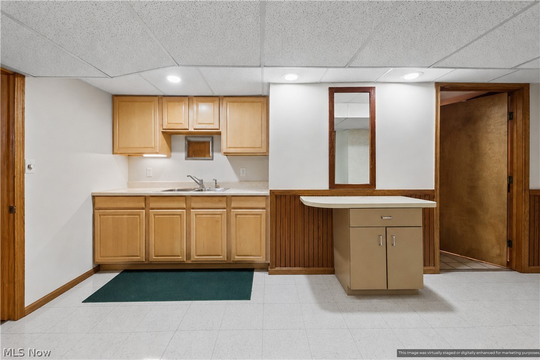 1835 Lynn Road Kent, OH 44240 - Photo 28 of 48 Kitchenette featuring light wood cabinetry, a stainless steel sink, and light-toned countertops