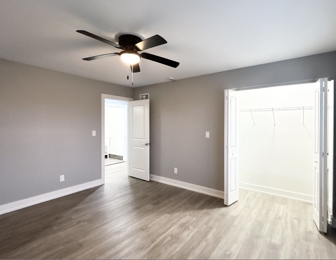 1400 8th Street Harvard, IL 60033 - Photo 9 of 11 a view of an empty room with wooden floor and a window