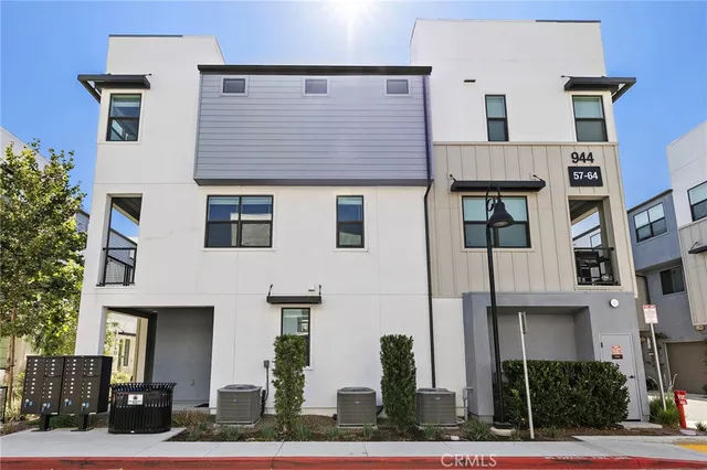a front view of residential houses with street