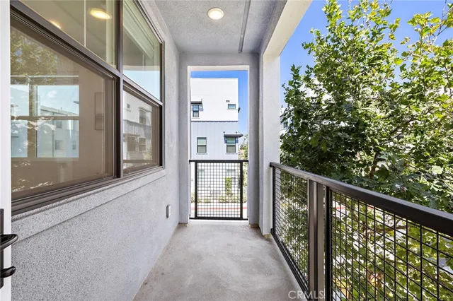 a view of a balcony with an outdoor space
