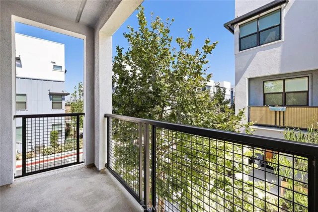 a view of balcony with a tree