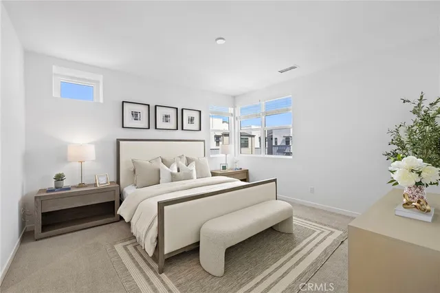 a bedroom with a bed and a table