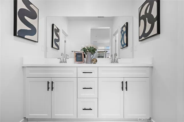 a bathroom with a sink and mirror