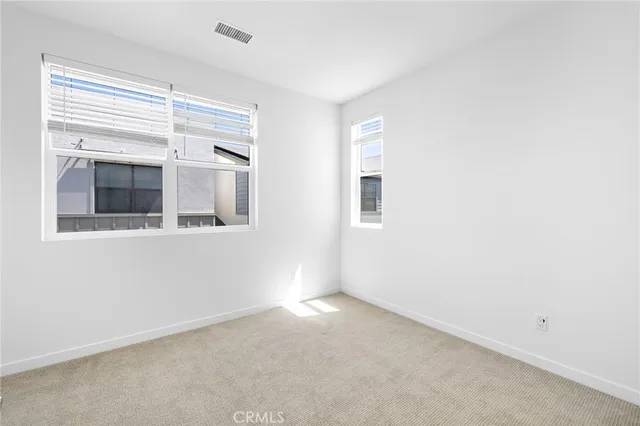 a view of empty room with windows