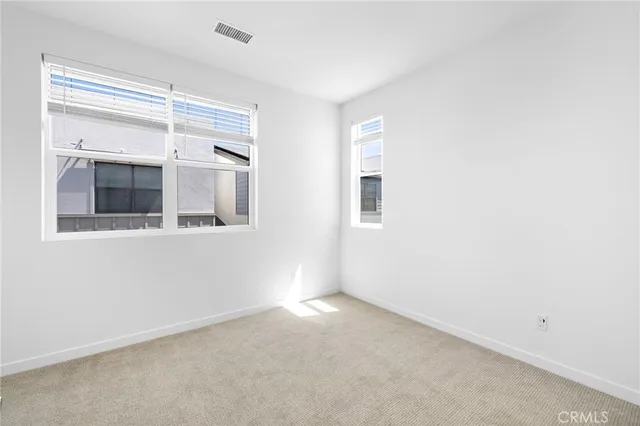 a view of empty room with windows