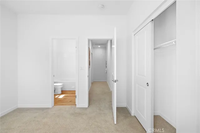 a view of a room with a wardrobe space