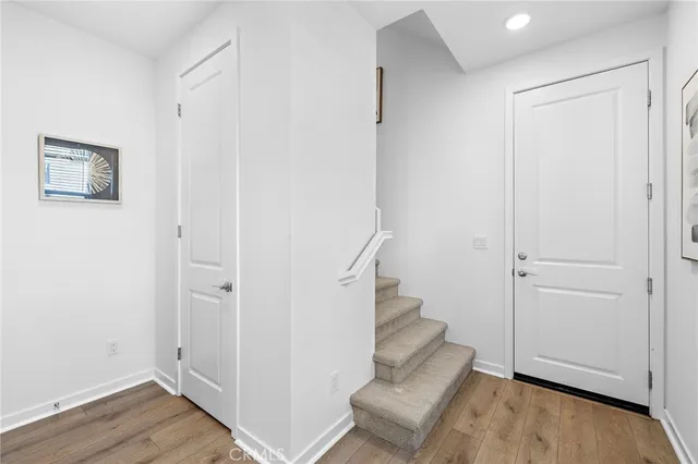 a view of entryway with wooden floor