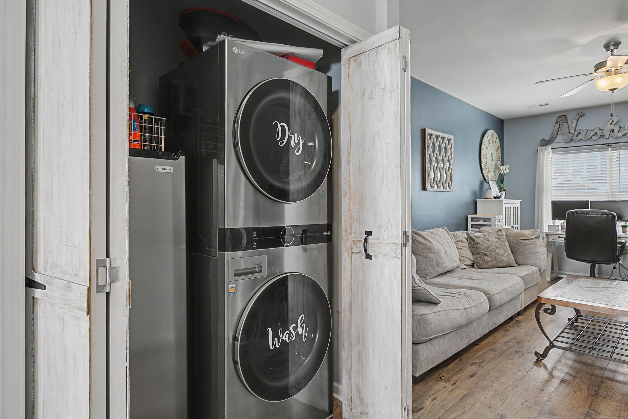202 Bell Forge Court White Bluff, TN 37187 - Photo 7 of 16 a living room with furniture and a washing machine with racks