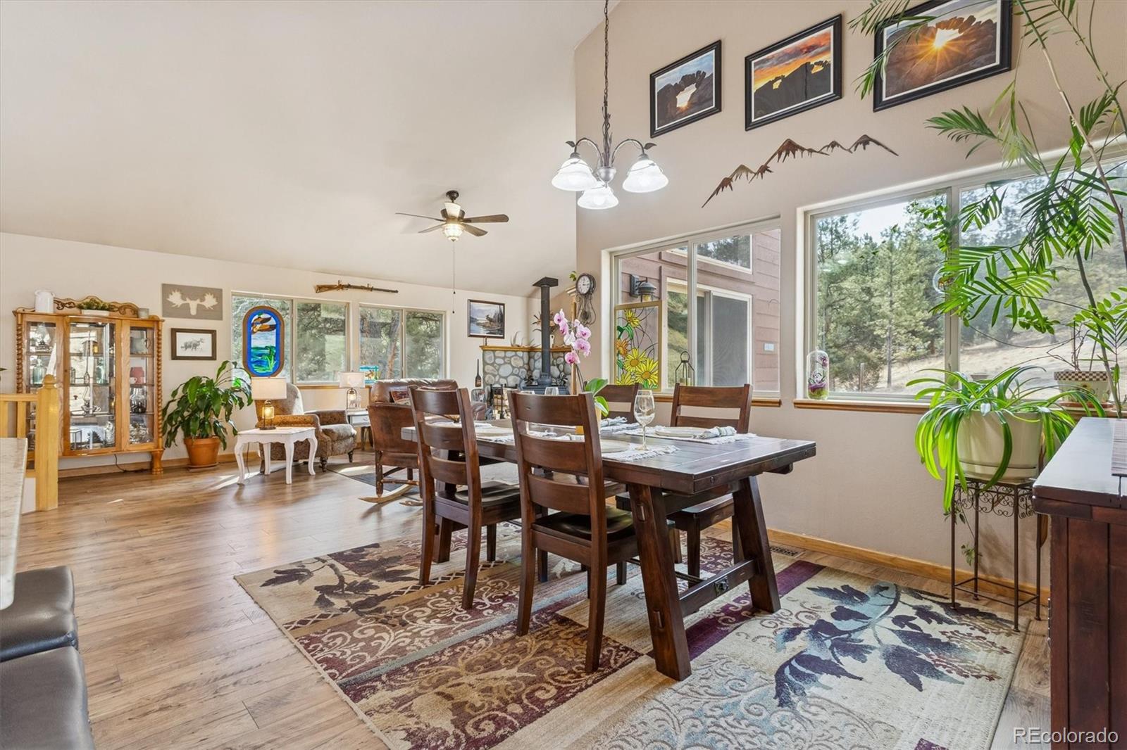 2230 County Road 72 Bailey, CO 80421 - Photo 14 of 50 a view of a dining room with furniture window and wooden floor