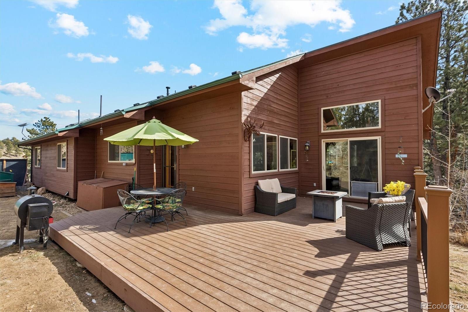 2230 County Road 72 Bailey, CO 80421 - Photo 30 of 50 a front view of a house with patio