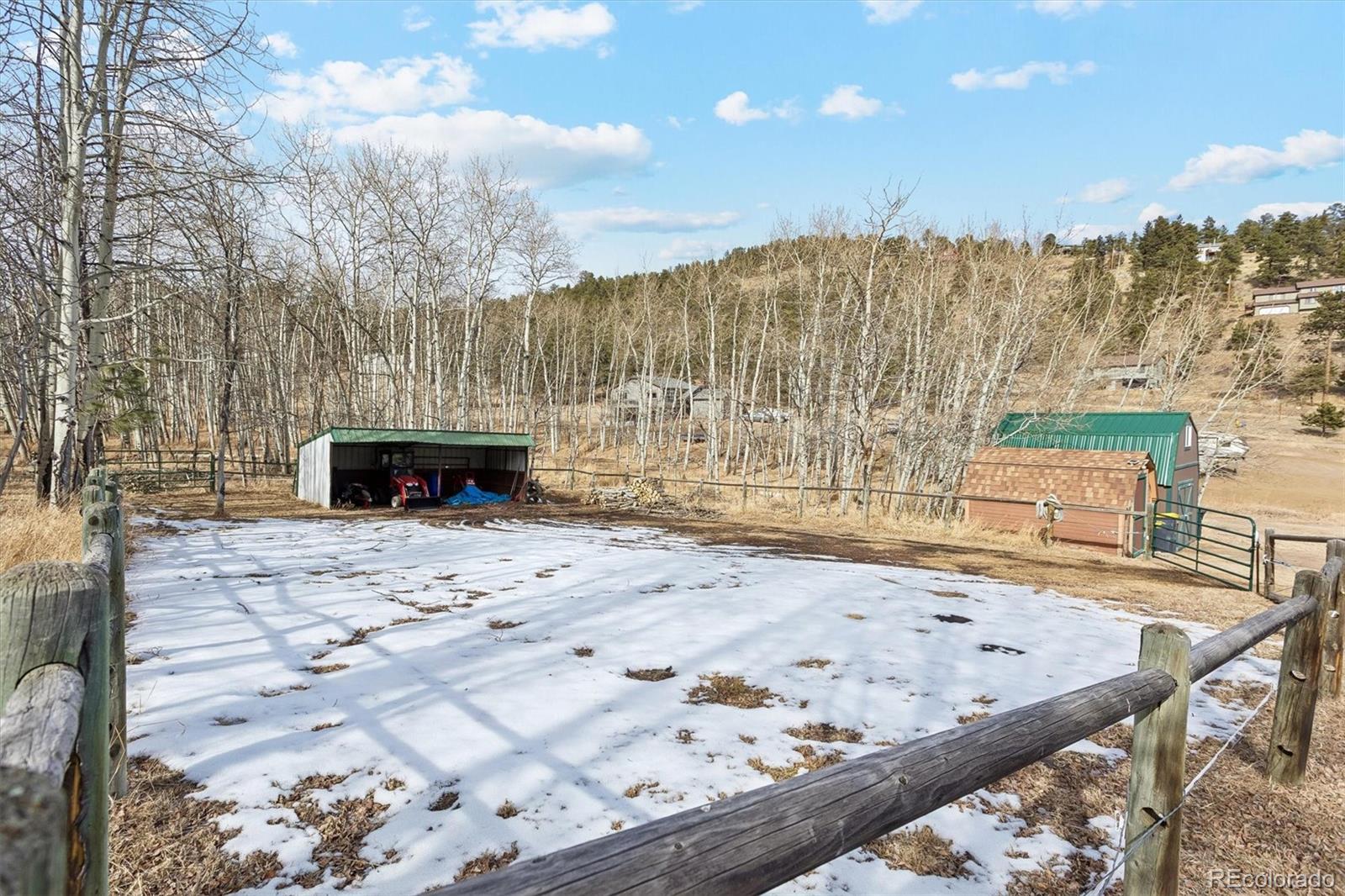 2230 County Road 72 Bailey, CO 80421 - Photo 42 of 50 a view of a backyard with wooden fence