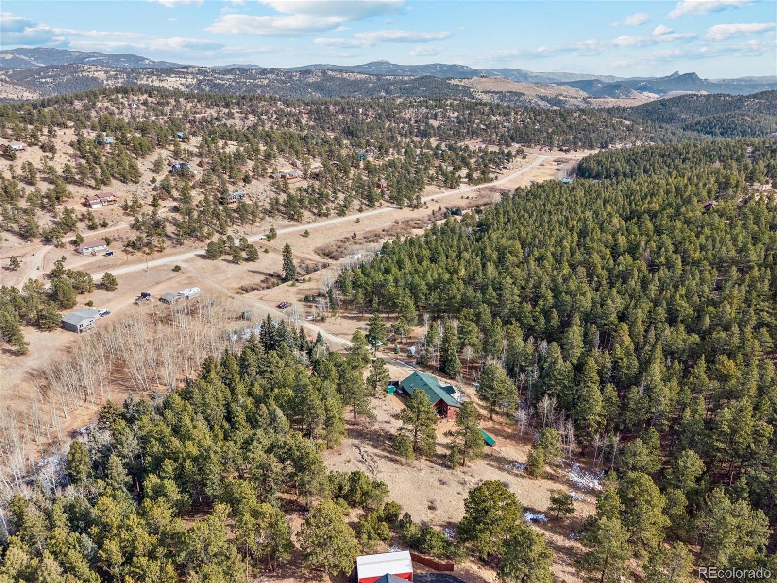 2230 County Road 72 Bailey, CO 80421 - Photo 45 of 50 an aerial view of house with yard and mountain view in back