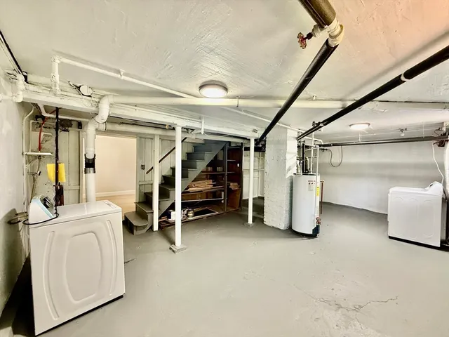 a view of a storage and utility room with stairs