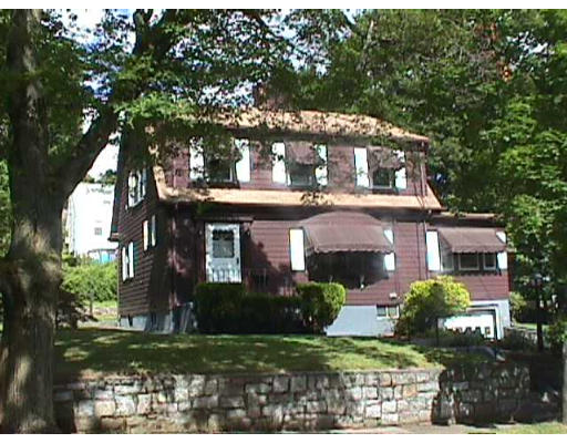 44 Allen Road Winchester, MA 01890 - Photo 2 of 4 a front view of a house with a garden