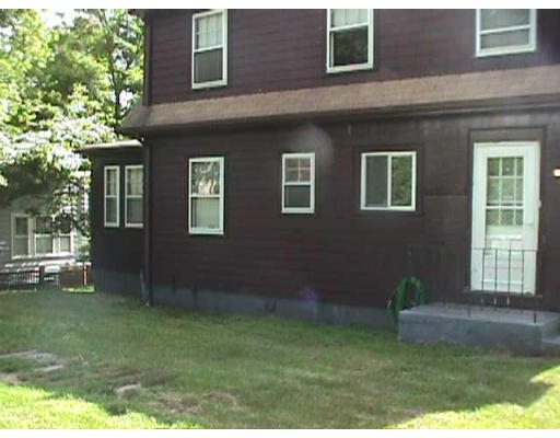 44 Allen Road Winchester, MA 01890 - Photo 3 of 4 a backyard of a house with seating space