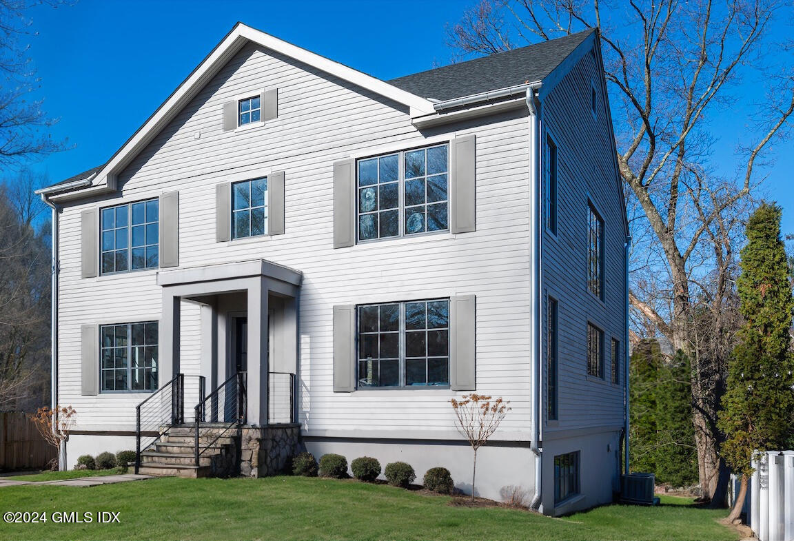 a view of house with yard