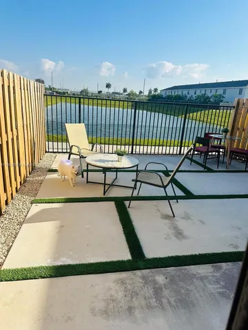 a view of a terrace with chairs