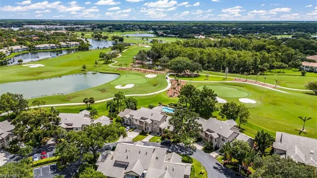 an aerial view of a house with a swimming pool outdoor seating and yard