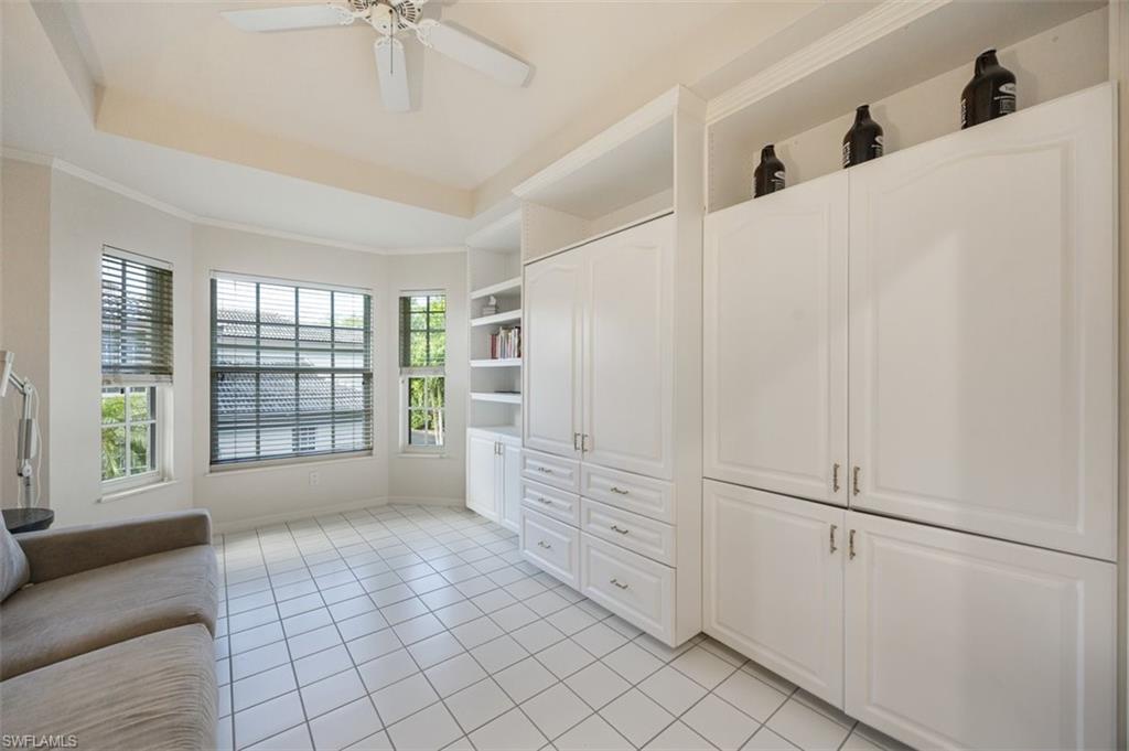164 Via Perignon, Unit 84 Naples, FL 34119 - Photo 14 of 34 a view of empty room with window and cabinet