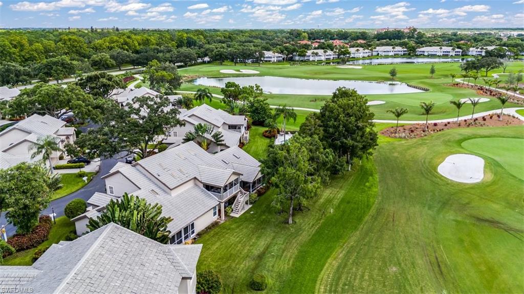 164 Via Perignon, Unit 84 Naples, FL 34119 - Photo 28 of 34 an aerial view of a house with outdoor space trees all around