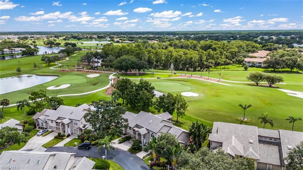 164 Via Perignon, Unit 84 Naples, FL 34119 - Photo 31 of 34 an aerial view of a houses with a yard